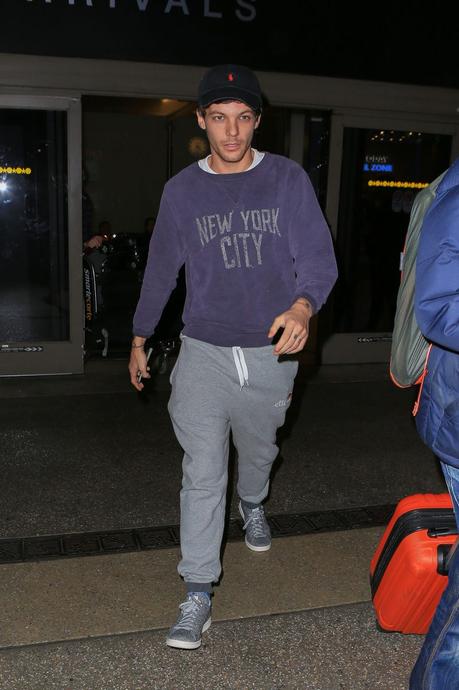 STYLE : Louis Tomlinson wearing  a Remi Relief sweatshirt