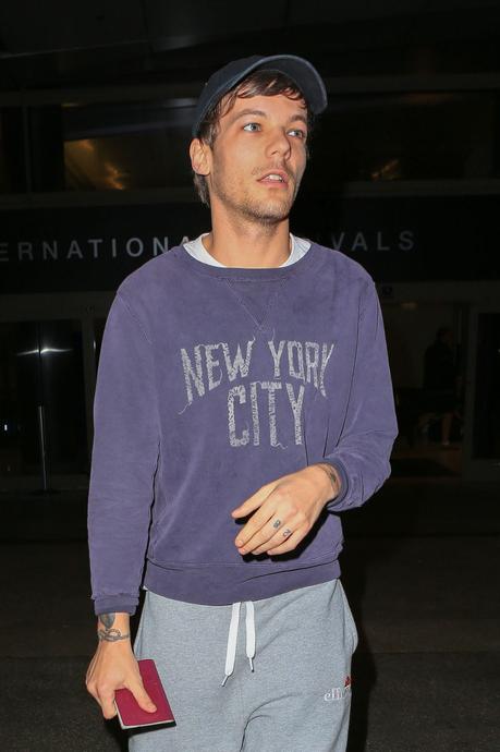 STYLE : Louis Tomlinson wearing  a Remi Relief sweatshirt